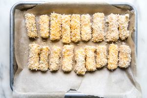 mozzarella cheese coated in flour, panko and eggs for homemade mozzarella sticks