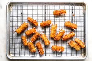 homemade mozzarella sticks on a cooling rack
