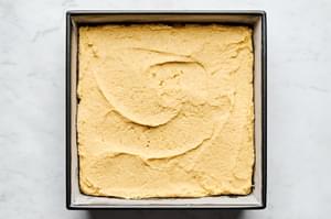 homemade cornbread batter in a greased 9x9 baking dish