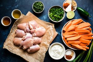 Chili-Honey Chicken & Sweet Potatoes sheet pan dinner ingredients. Cilantro Yogurt, jalapeño and green onions.