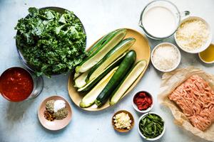 zucchini boats, tomato sauce, cream, mozzarella, parmesan, ground chicken and kale for zucchini boats
