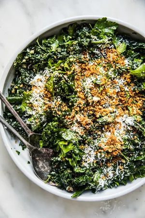 Kale Salad with Lemon Parmesan Dressing with crispy panko in a bowl
