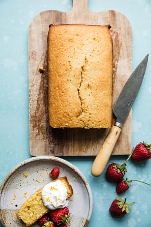 lemon olive oil pound cake with fresh berries and whipped cream,