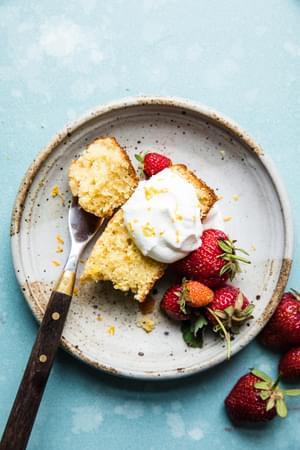 lemon olive oil pound cake with fresh berries and whipped cream,