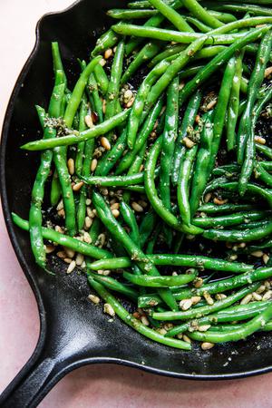 pesto green beans in a skillet