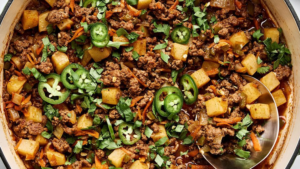 picadillo topped with fresh cilantro and jalapeños, served with rice and a warm tortillas on the side