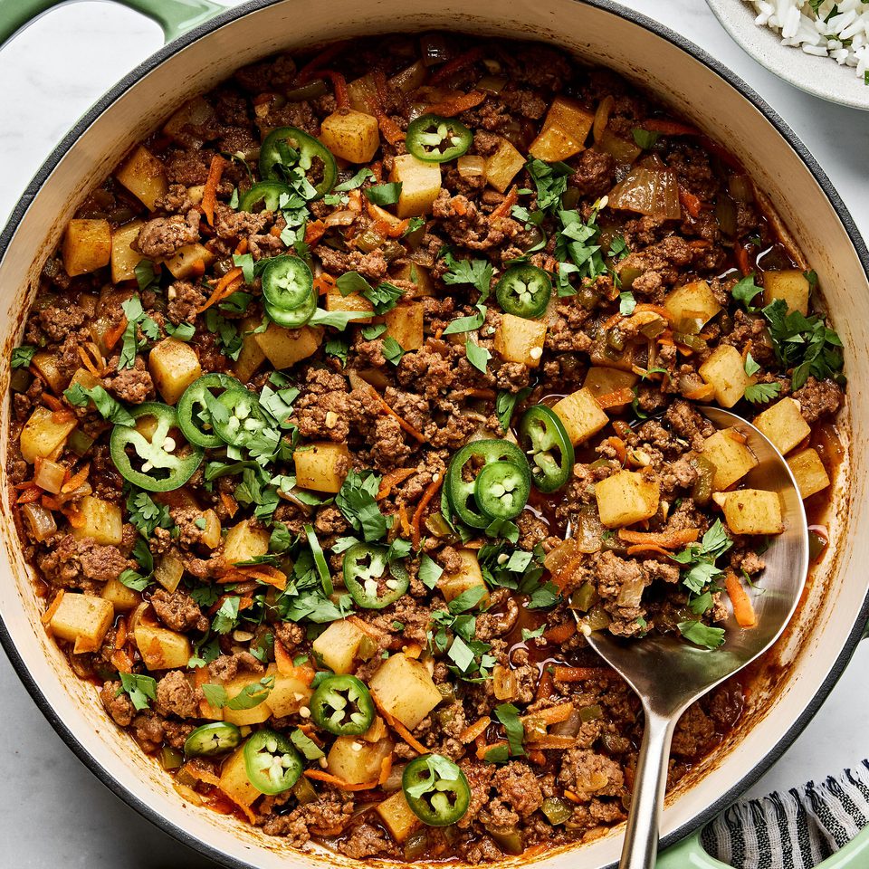 picadillo topped with fresh cilantro and jalapeños, served with rice and a warm tortillas on the side