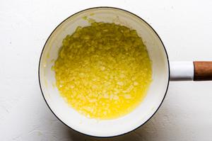 butter and diced onions cooking in a sauce pan