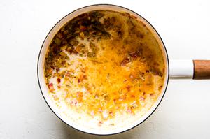 butter, onions, tomatoes, chiles, cornstarch and whole milk in a sauce pan