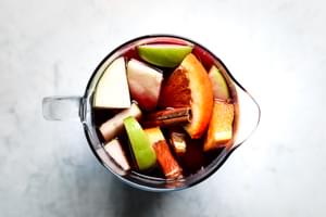 Red Wine Sangria Recipe with cinnamon, apples, oranges, brandy and triple sec.