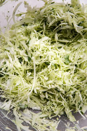 homemade cabbage slaw in a bowl to use on top of easy shrimp tacos