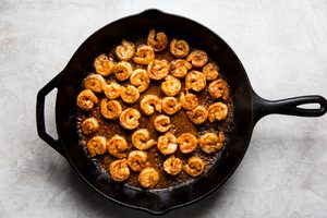 shrimp marinated in taco seasoning, olive oil and lime juice being cooked in a skillet for shrimp tacos