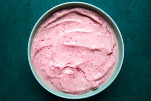 homemade smoothie bowl made with strawberries and bananas in a bowl on the counter