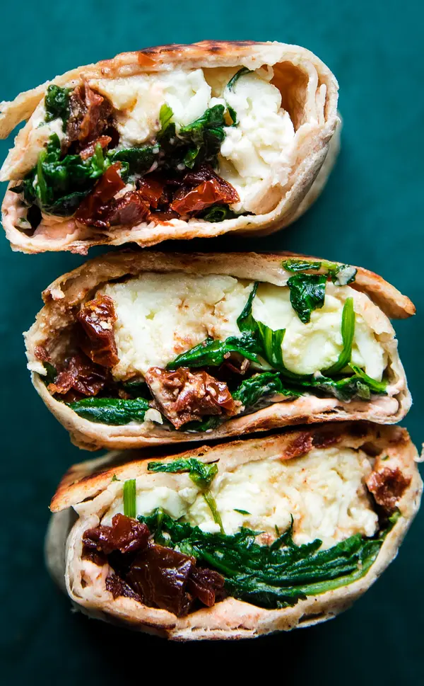 spinach feta wraps filled with tomato cream cheese, sun dried tomatoes, feta & scrambled egg whites