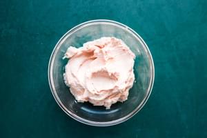 cream cheese, tomato paste, salt, garlic powder, and onion powder mixed together in a glass bowl