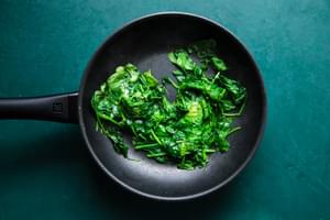 sautéed spinach in a pan