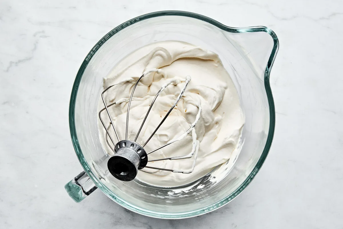 homemade whipped cream with a light, fluffy texture and soft peaks, freshly made and ready for serving