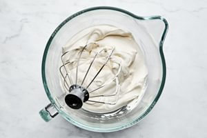 homemade whipped cream with a light, fluffy texture and soft peaks, freshly made and ready for serving