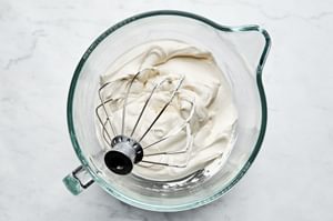 homemade whipped cream with a light, fluffy texture and soft peaks, freshly made and ready for serving