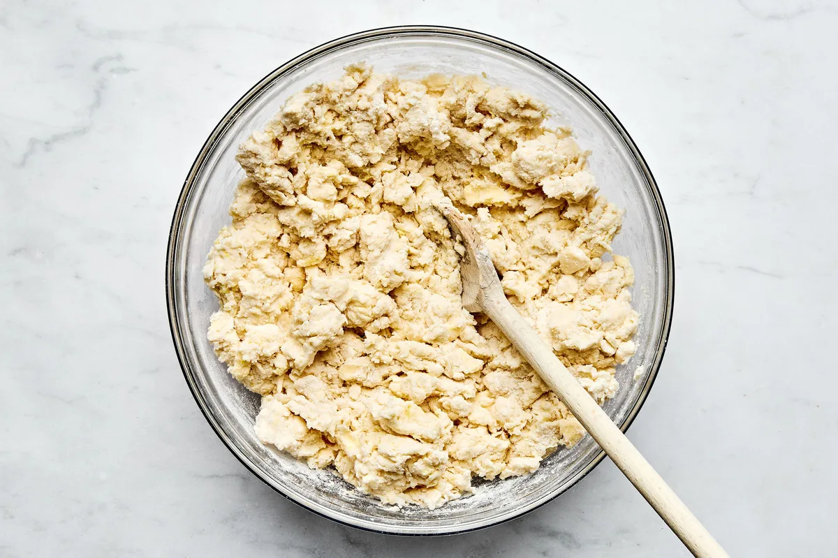 a bowl of homemade biscuit dough to be used for strawberry shortcakes
