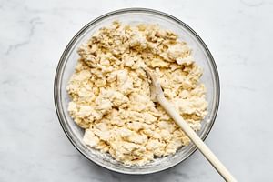 a bowl of homemade biscuit dough to be used for strawberry shortcakes