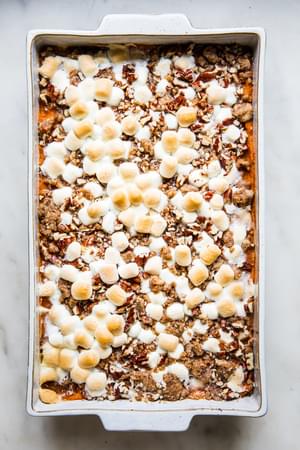 baked Homemade Sweet Potato Casserole with Marshmallows and Pecan Streusel in a baking dish