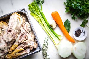 cooked turkey pieces, carrot, celery, onion, parsley, salt and pepper for homemade turkey stock
