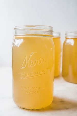 Homemade turkey stock in a glass jar