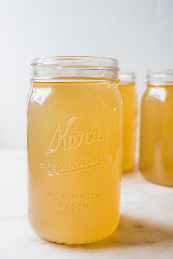Homemade turkey stock in a glass jar