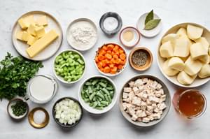 potatoes, celery, onion, carrots, butter, milk, flour, stock, green beans, turkey and spices in prep bowls