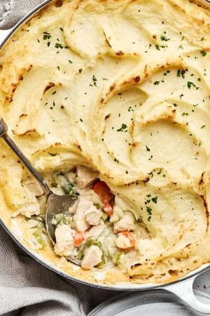 turkey shepherd's pie filled with turkey, onion, celery, carrots, green beans & topped with garlic mashed potatoes