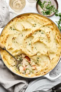 turkey shepherd's pie filled with turkey, onion, celery, carrots, green beans & topped with garlic mashed potatoes