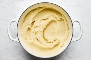 a pot of homemade garlic mashed potatoes for topping shepherds pie