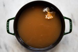 homemade wassail steeping
in a pot