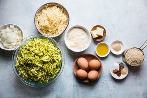 eggs, shredded zucchini, panko, butter, onion
