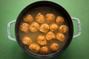 chicken meatballs, ditalini in chicken broth in a stock pot