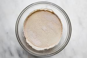 a large bowl of warm water and yeast