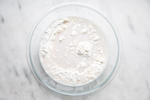 flour, salt, water and yeast in a bowl for homemade focaccia bread