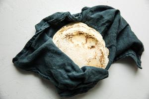 Homemade corn tortillas in a linen