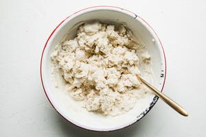 masa and water mixed together in a bowl for homemade corn tortillas