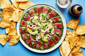 homemade aguachile on a serving platter surrounded by tortilla chips for serving