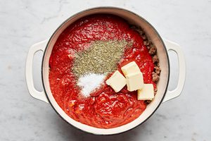 ground beef, italian sausage, marinara butter and spices in a soup pot for making baked rigatoni
