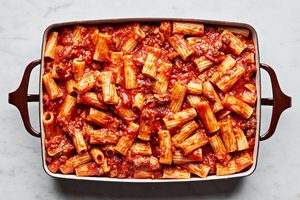 rigatoni with marinara sauce, italian sausage and ground beef in a 9x13 casserole dish