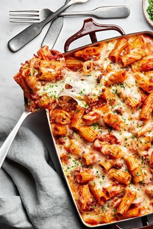 homemade bake rigatoni  in a 9x13 casserole dish made with italian sausage and ground beef