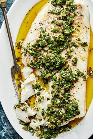 homemade Baked Cod with Parsley Olive Tapenade made with parsley, olives, anchovy, garlic, lemon zest & juice and seasonings