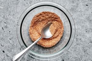 salt, garlic powder, onion powder, pepper, chili powder, paprika and cayenne mixed in a bowl for dry rub to put on pork ribs