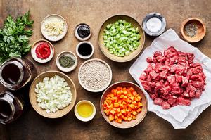 roast, spices, vegetables, tomato paste, bouillon, stock, soy sauce & barley in bowls to make beef & barley soup