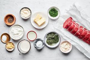 Beef tenderloin on parchment, salt, pepper, butter, garlic, sage, rosemary, thyme, cream, horseradish sauce and sour cream