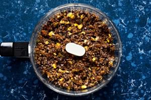 black beans, carrots, cilantro, cumin, onion, salt, paprika, chili powder, egg and breadcrumbs pulsed in a food processor