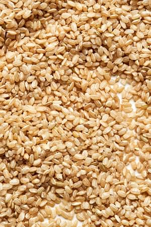 dried brown rice ready to be cooked in water, salt and olive oil